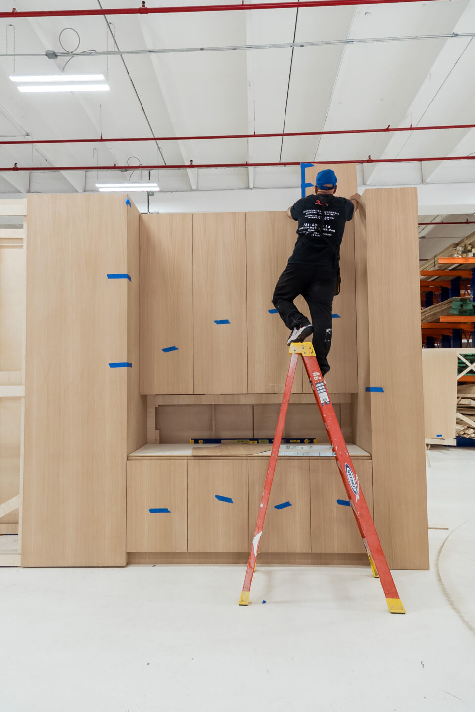 ROA craftsman assembling custom cabinetry